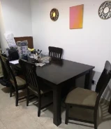 Dining table big with 6 chairs. 6.5 ft x 3.5 ft approx. As is.