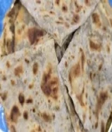 طعام خبز صاج فلزن مهياوة بالزبدة وزيت زيتون ودهن عداني بالمهياوة واجار ثوم يبل مع طماط ومهياوة
