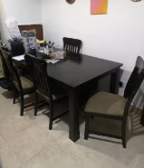 Dining table big with 6 chairs. 6.5 ft x 3.5 ft approx. As is.