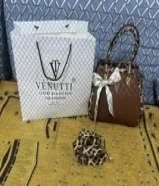 اي شنطه بسته دينار والبوك بدينارين